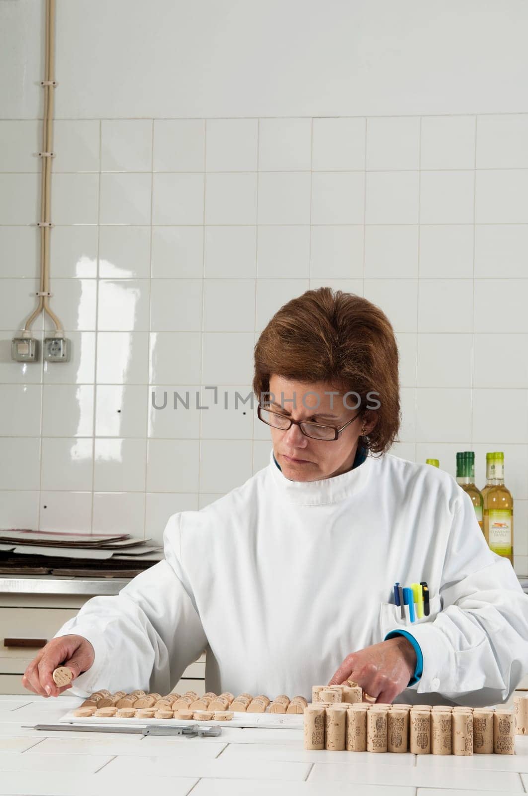 Woman checking cork stoppers