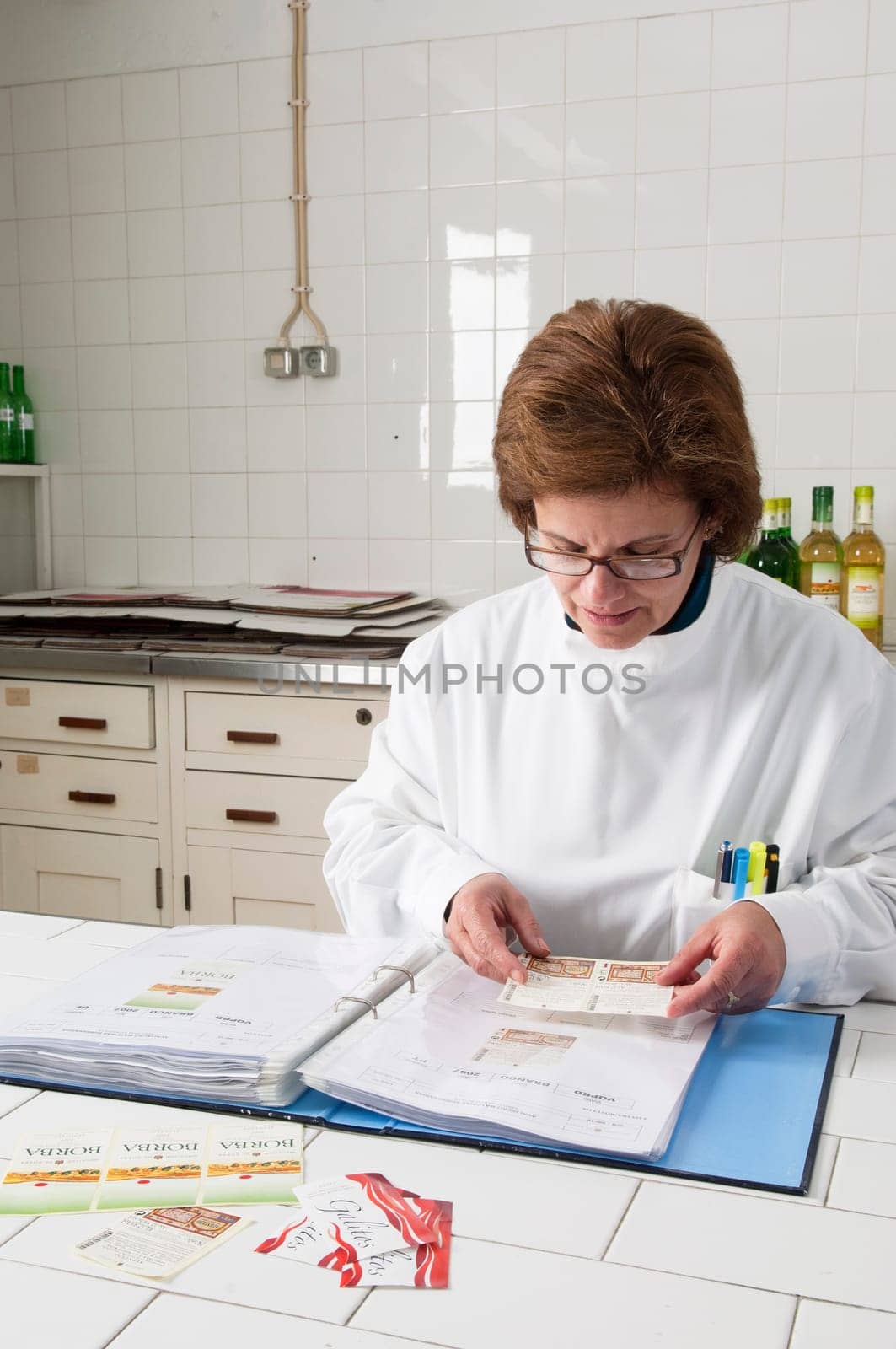 Woman checking wine labels