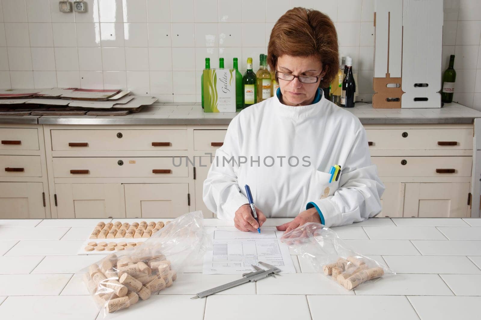 Woman checking cork stoppers