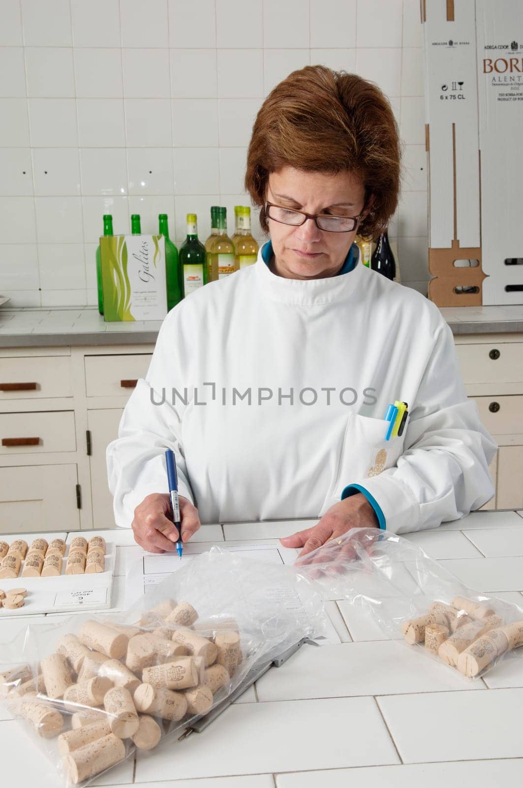 Woman checking cork stoppers