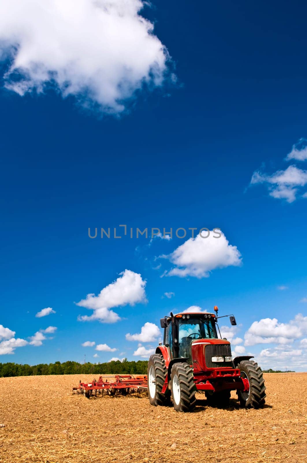 Tractor in plowed field