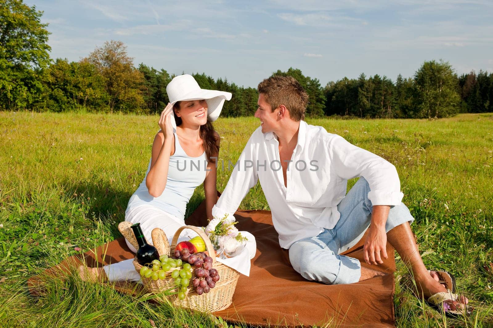 Picnic - Romantic couple in spring nature