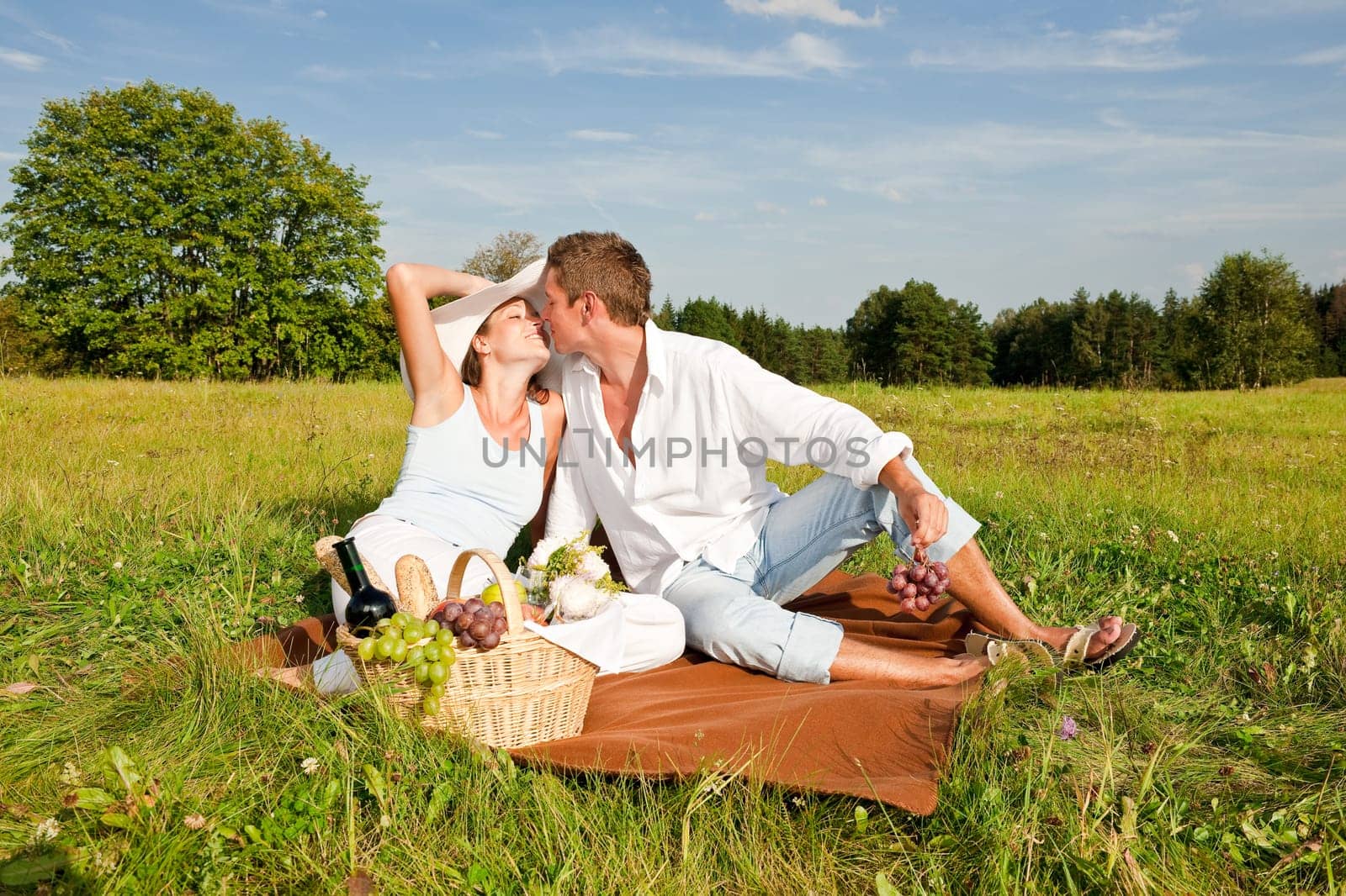 Picnic - Romantic couple in spring nature