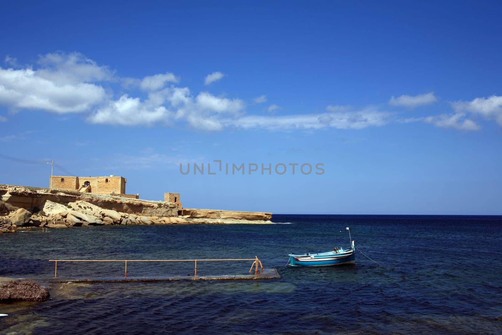 Fishing boat and house in Gozo