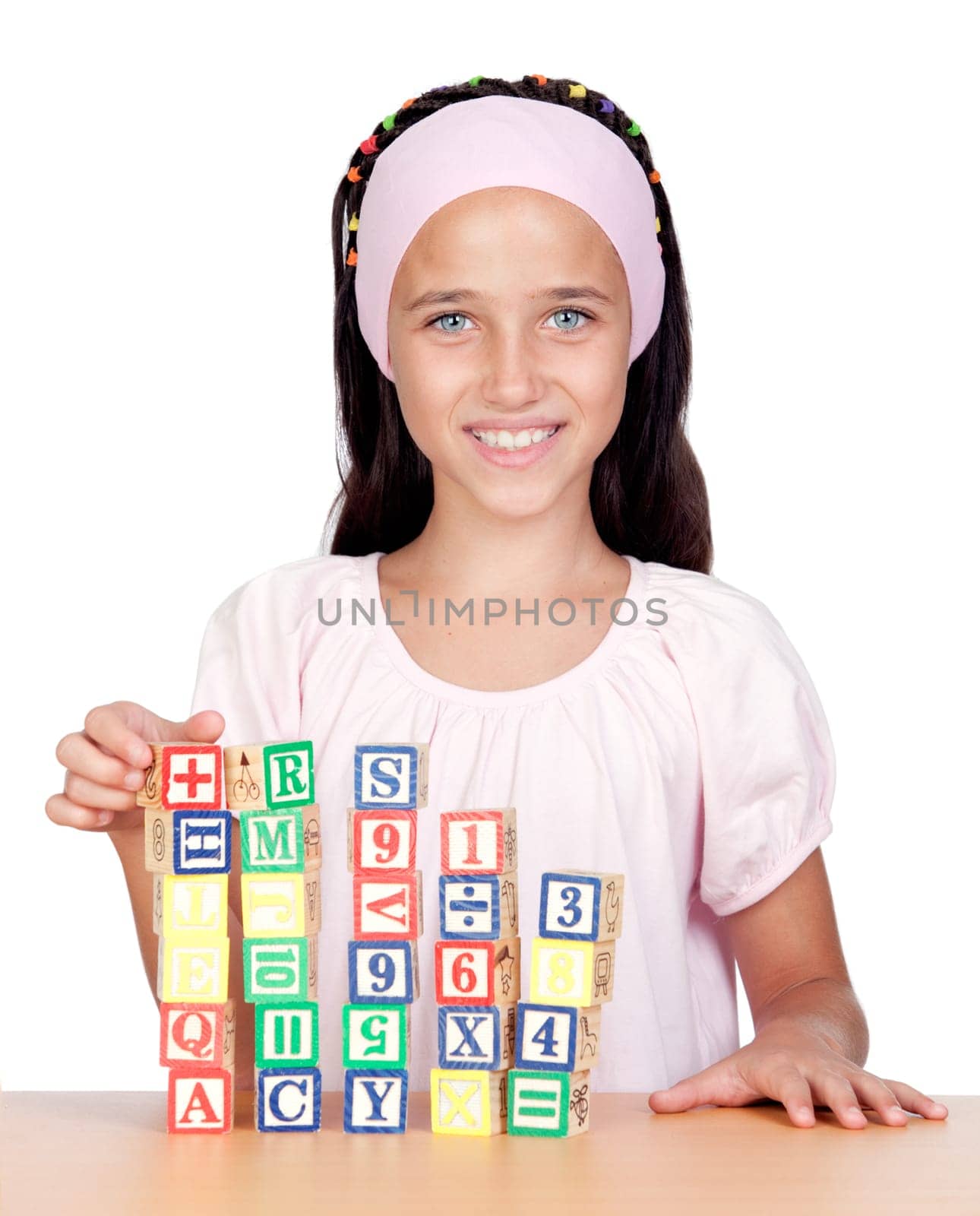 Little girl with wooden blocks stac