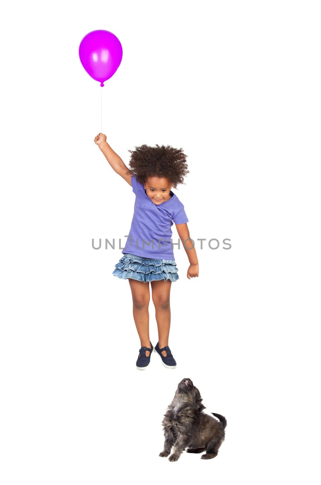 Puppy girl looking at a fly with ballon