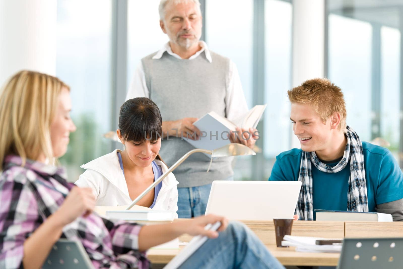 High school - three students with mature professor