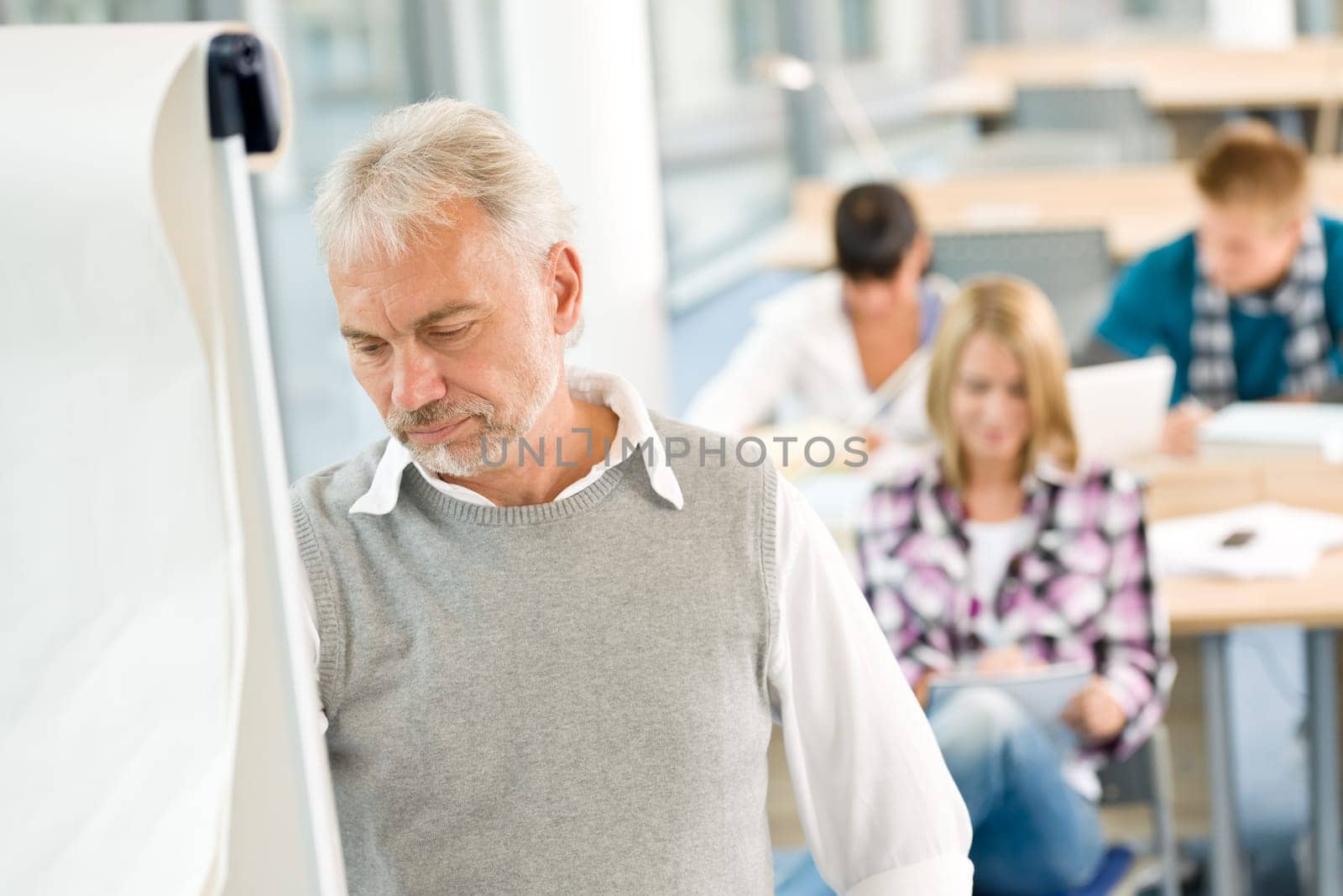 High school - three students with mature professor