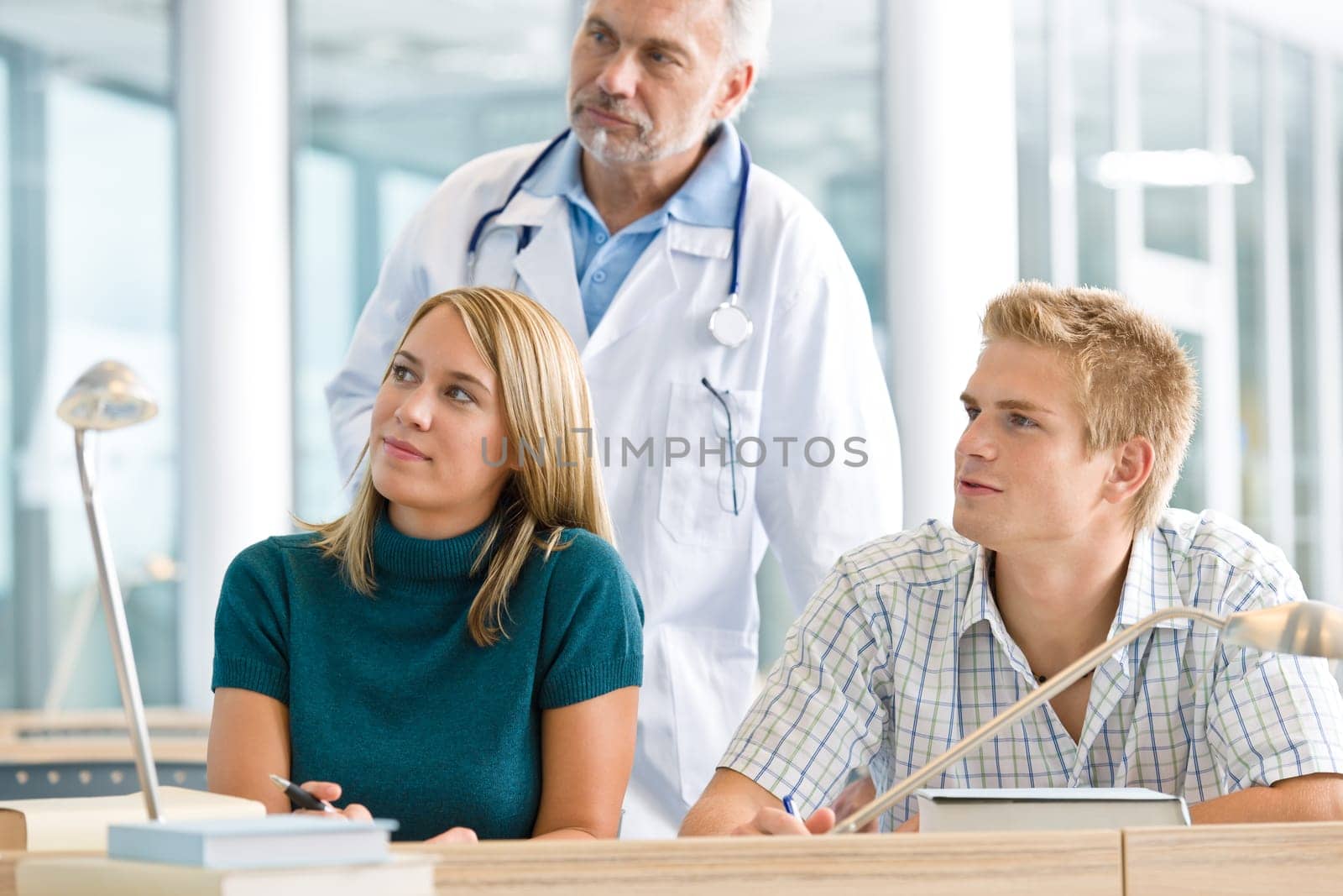 Medical students with professor in classroom