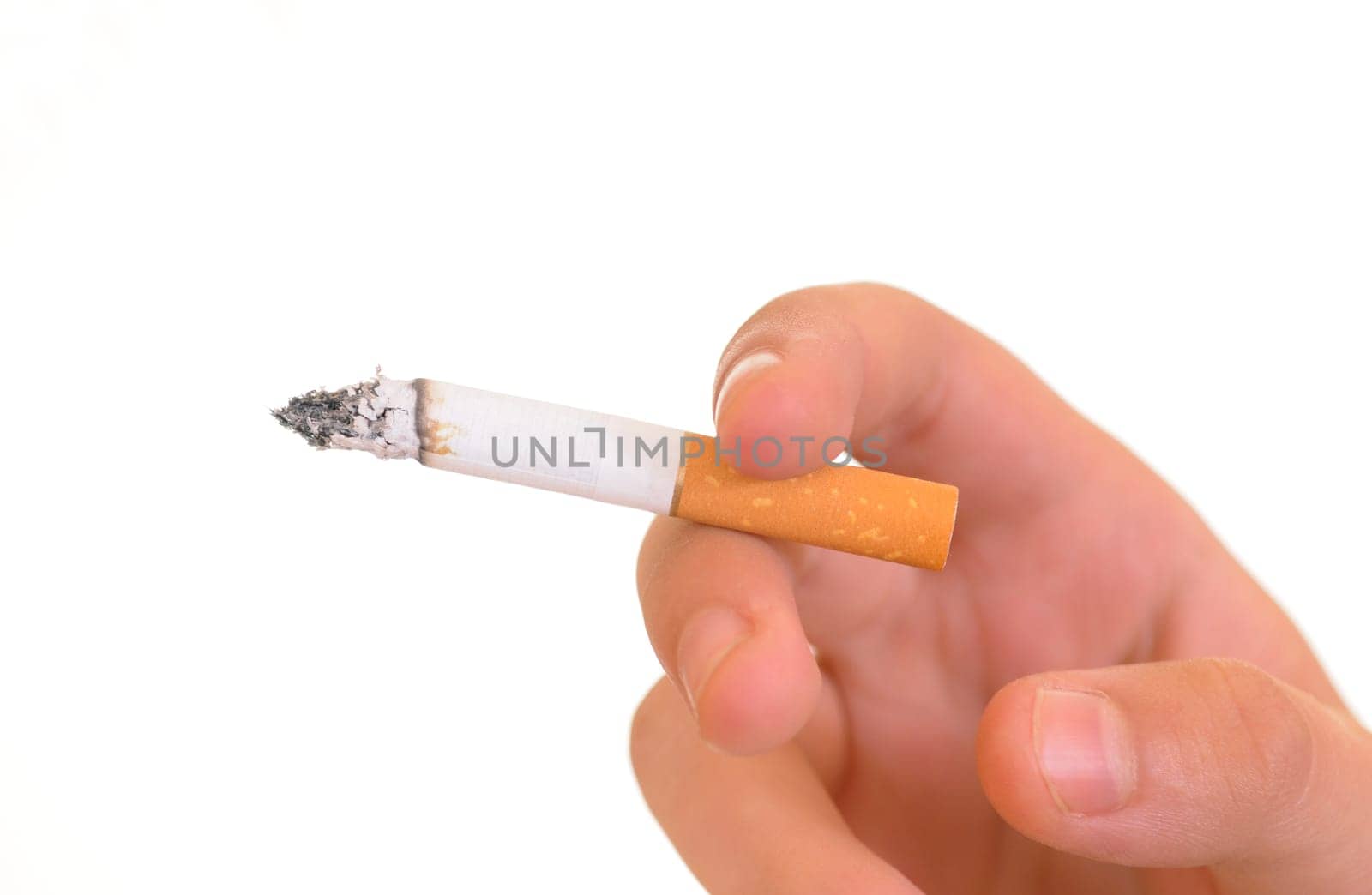 Hand holding a lit cigarette