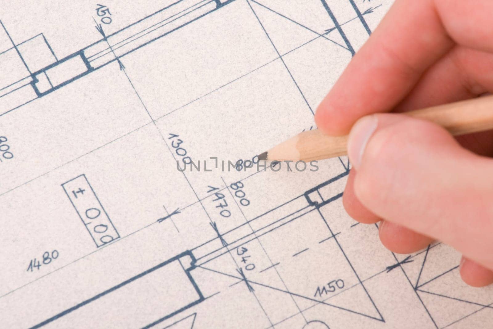 Architect with blueprint