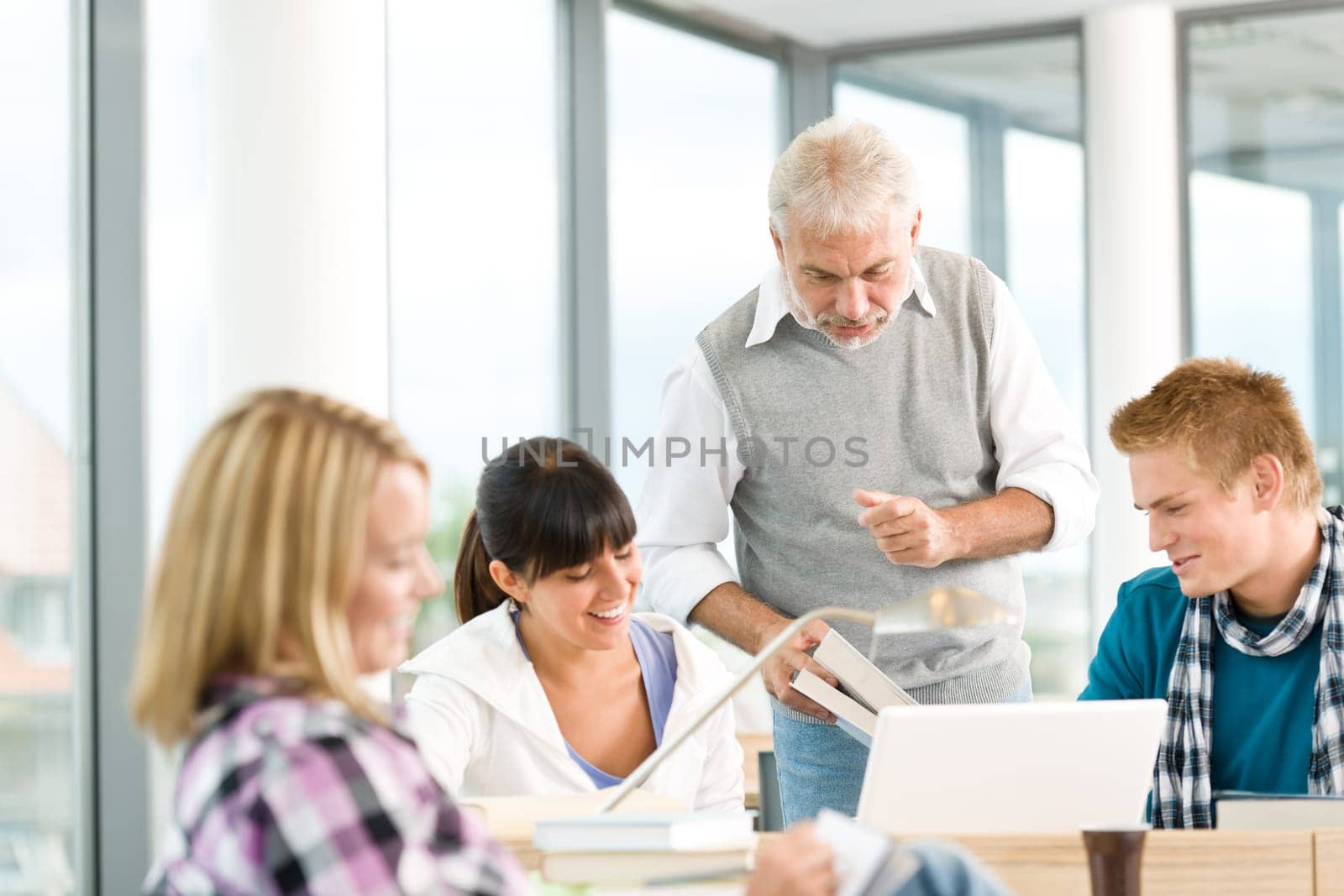 High school - three students with professor
