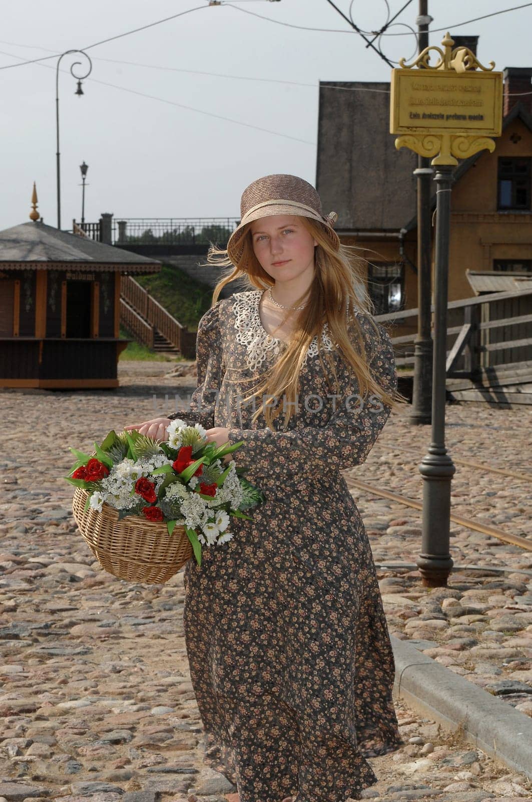 Girl with basket of flowers
