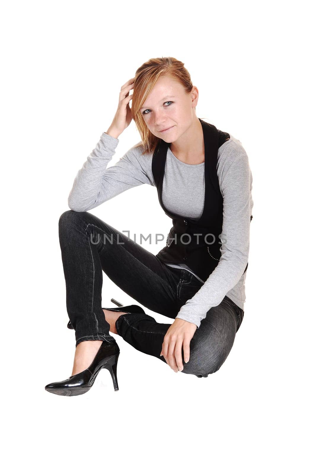 Girl sitting on floor.