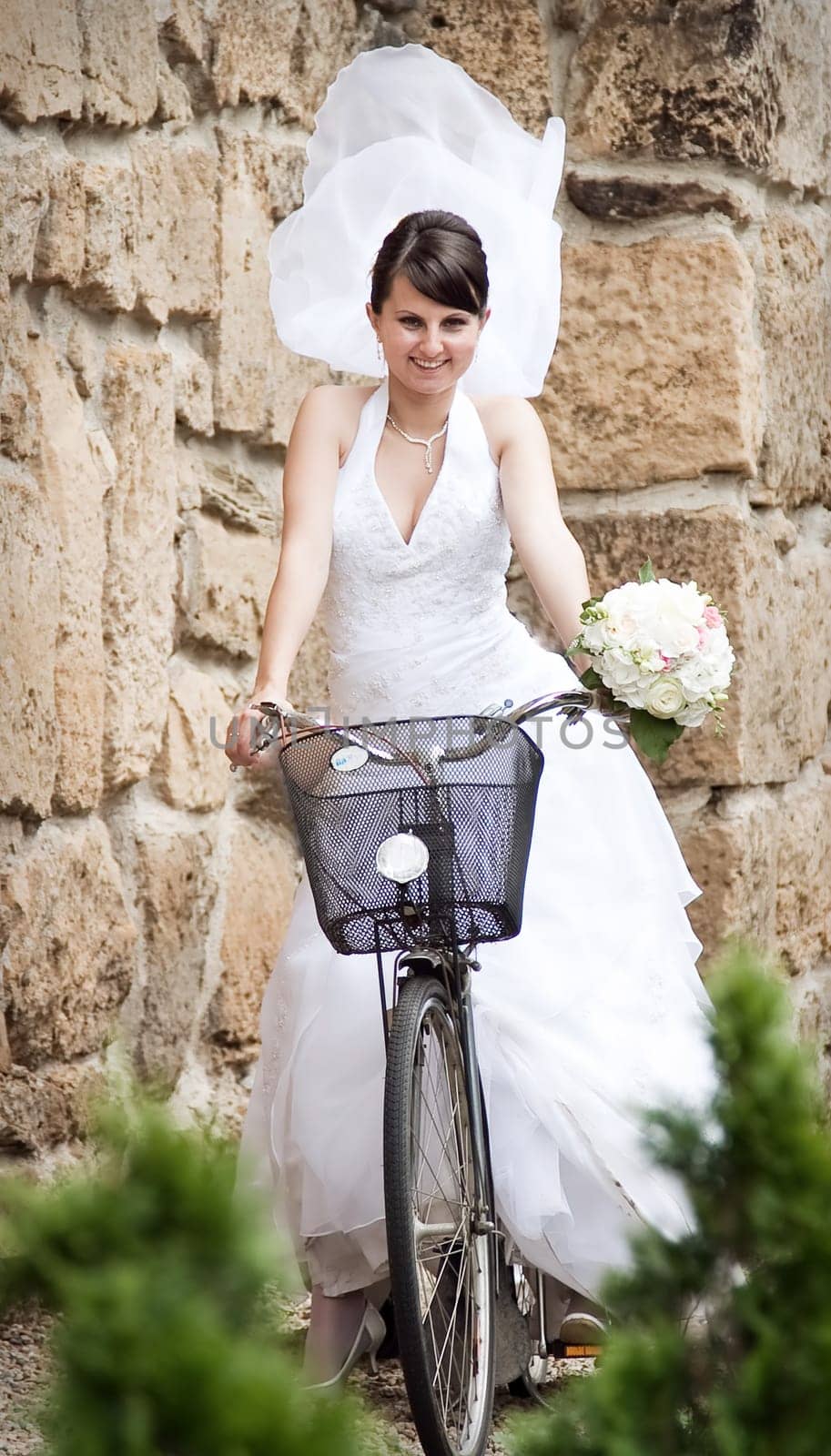 Bride  posing on bicycle