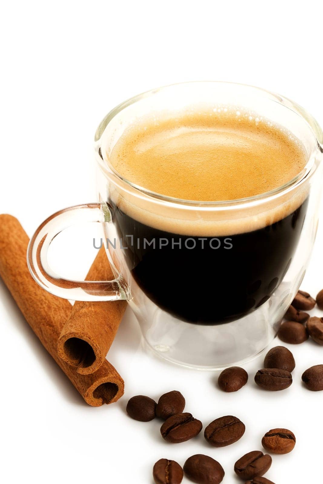 Espresso with coffee beans and cinnamon