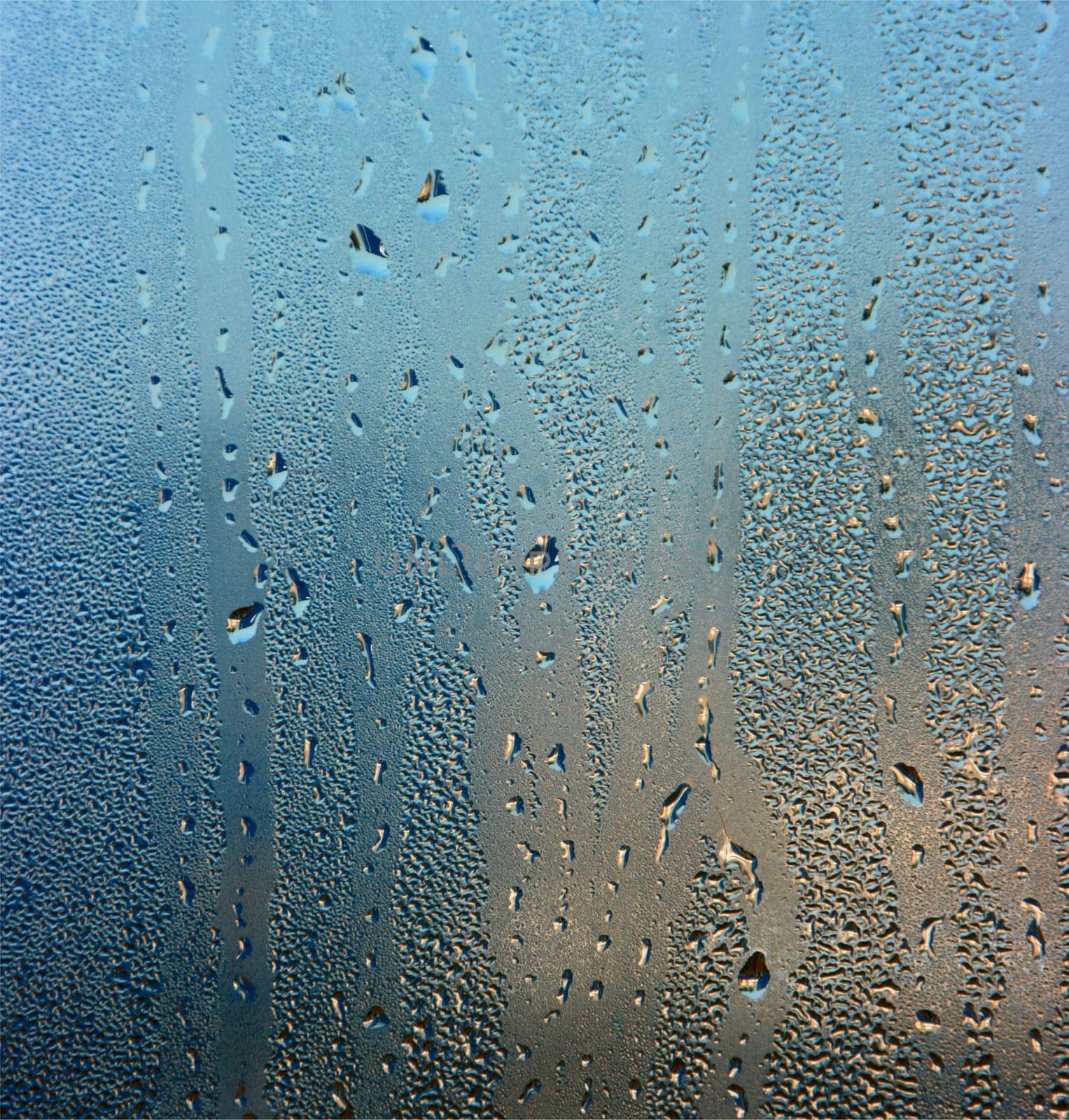 Colorful waterdrops on the window