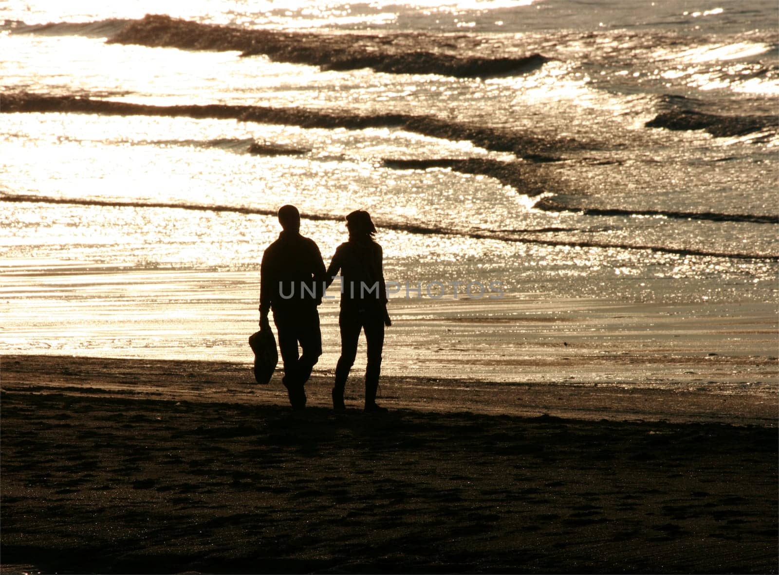 Couple walking hand in hand
