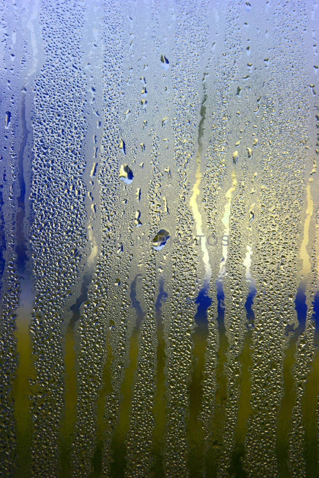 Colorful waterdrops on the window