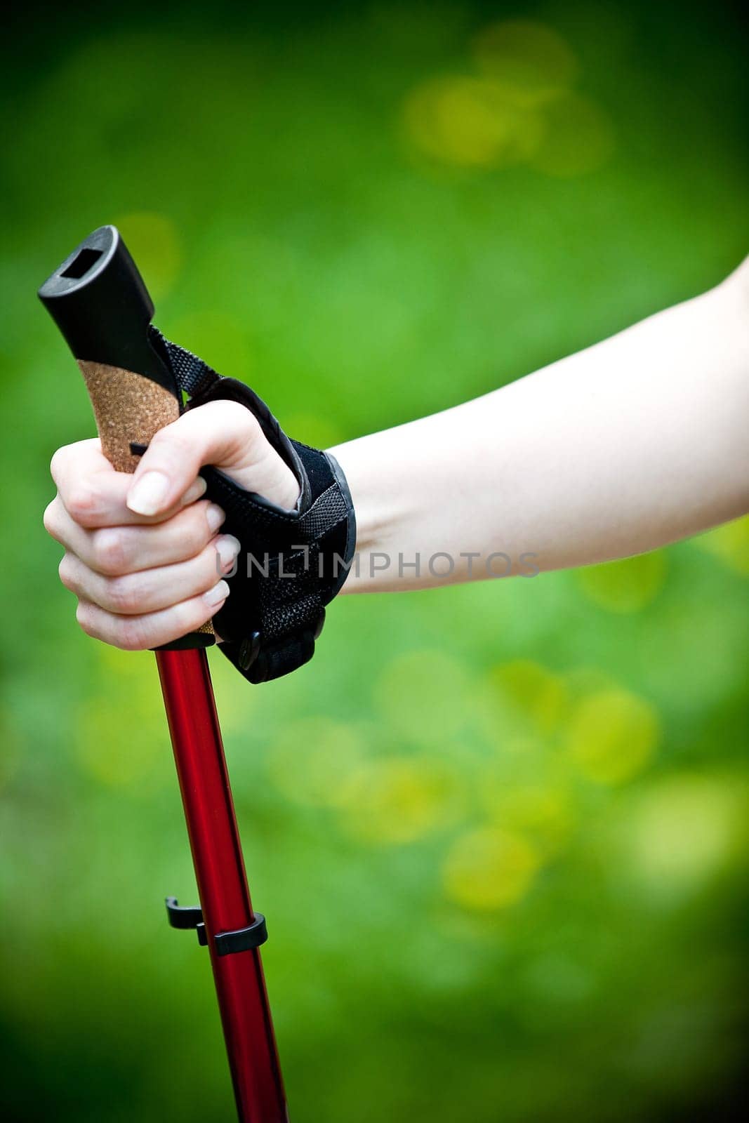 Nordic Walking - Young woman is hiking