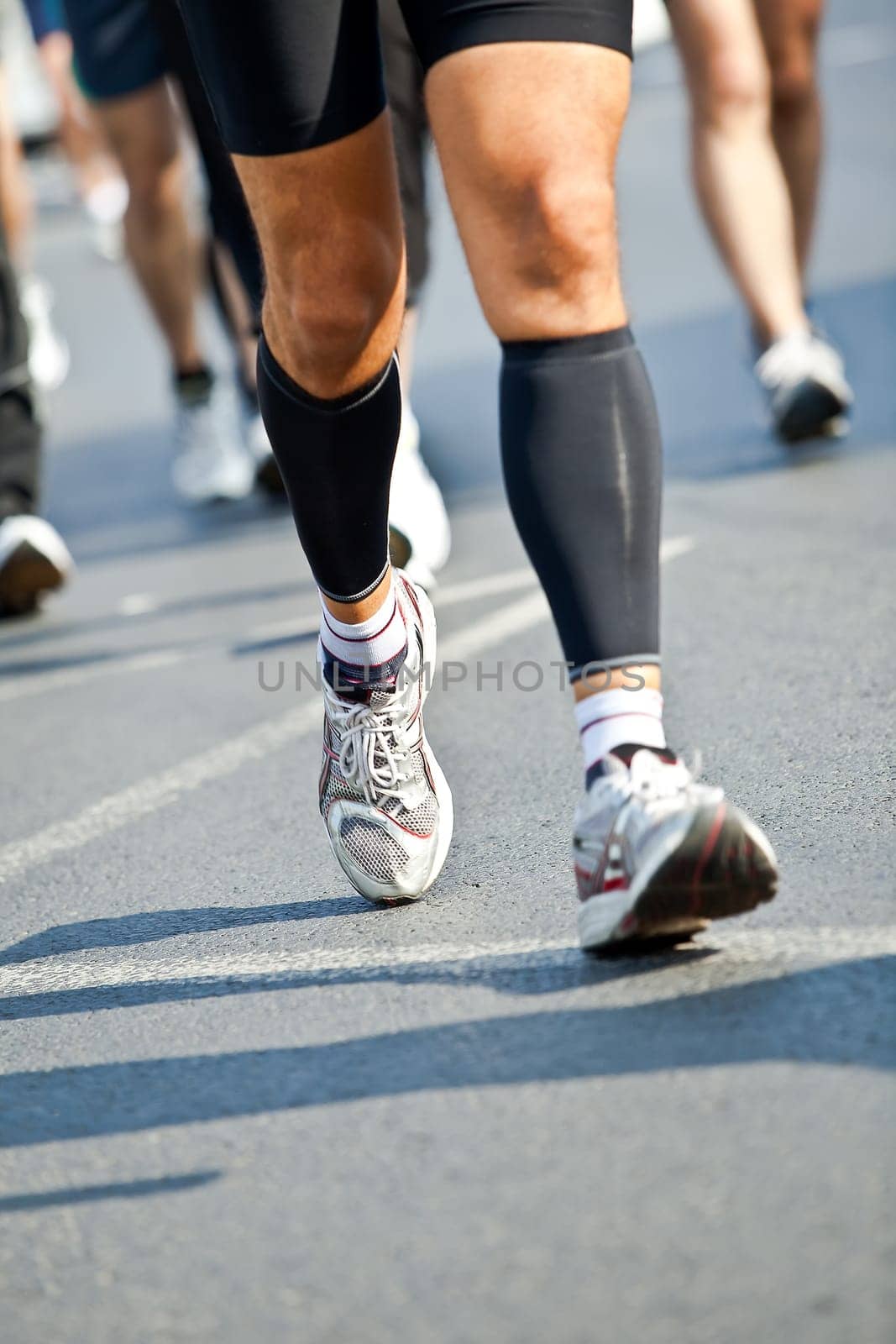 People running in city marathon