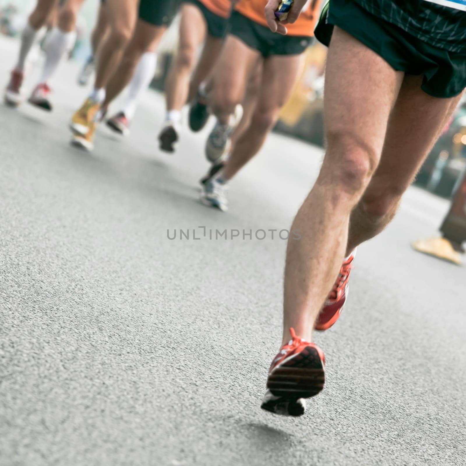 People running in city marathon