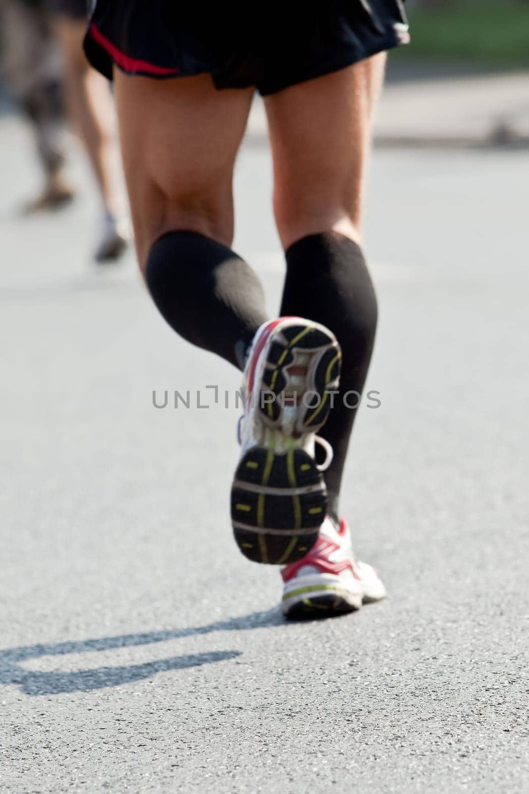 People running in city marathon