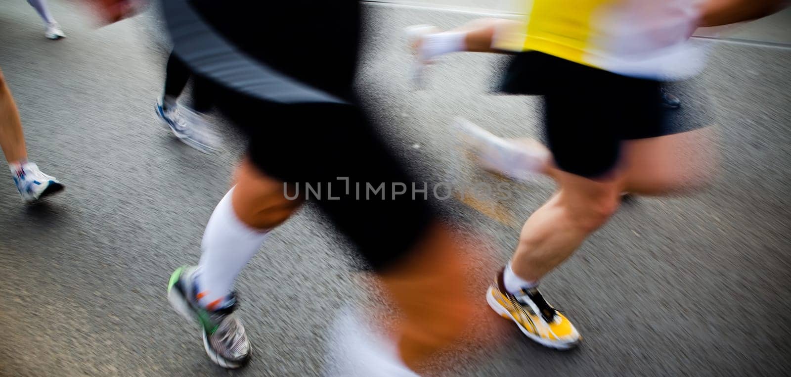 People running in city marathon