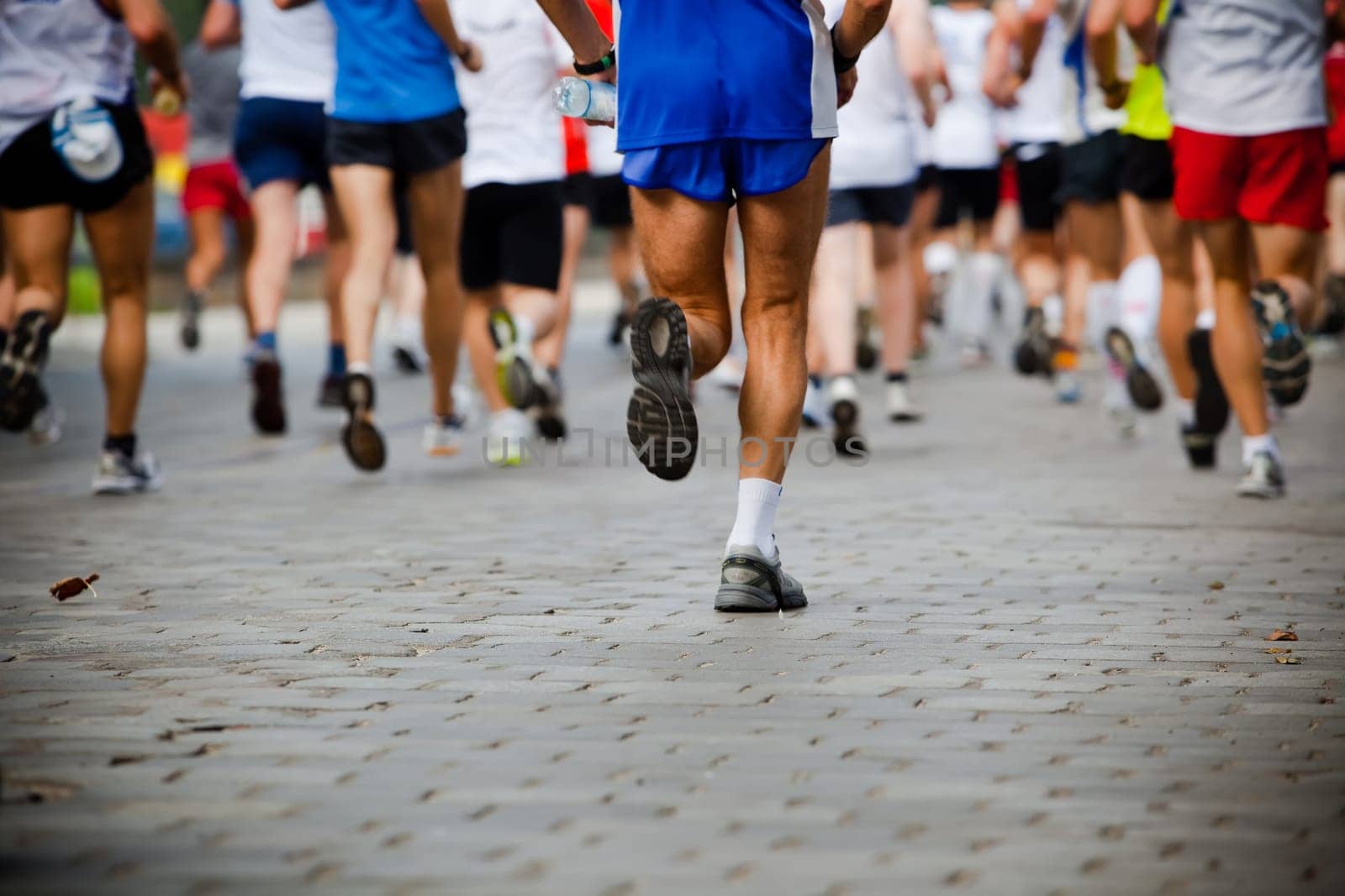 People running in city marathon