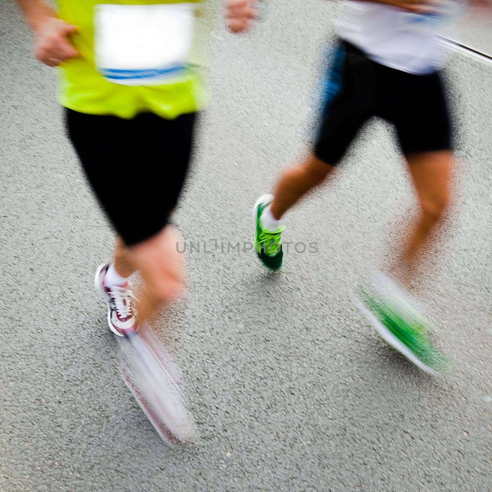 People running in city marathon