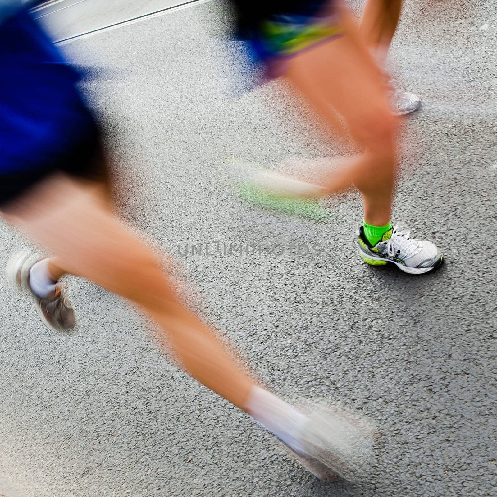 People running in city marathon