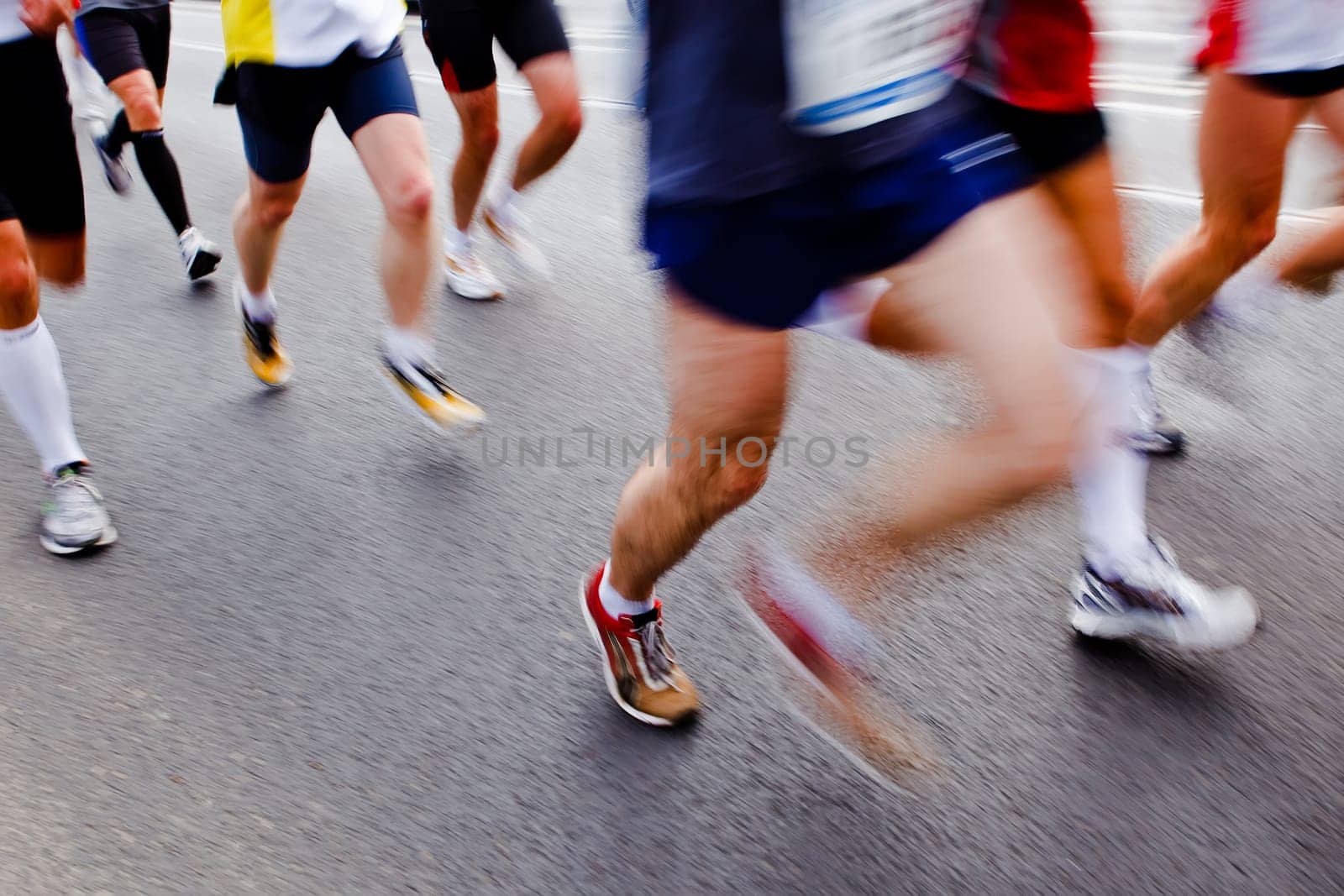 People running in city marathon