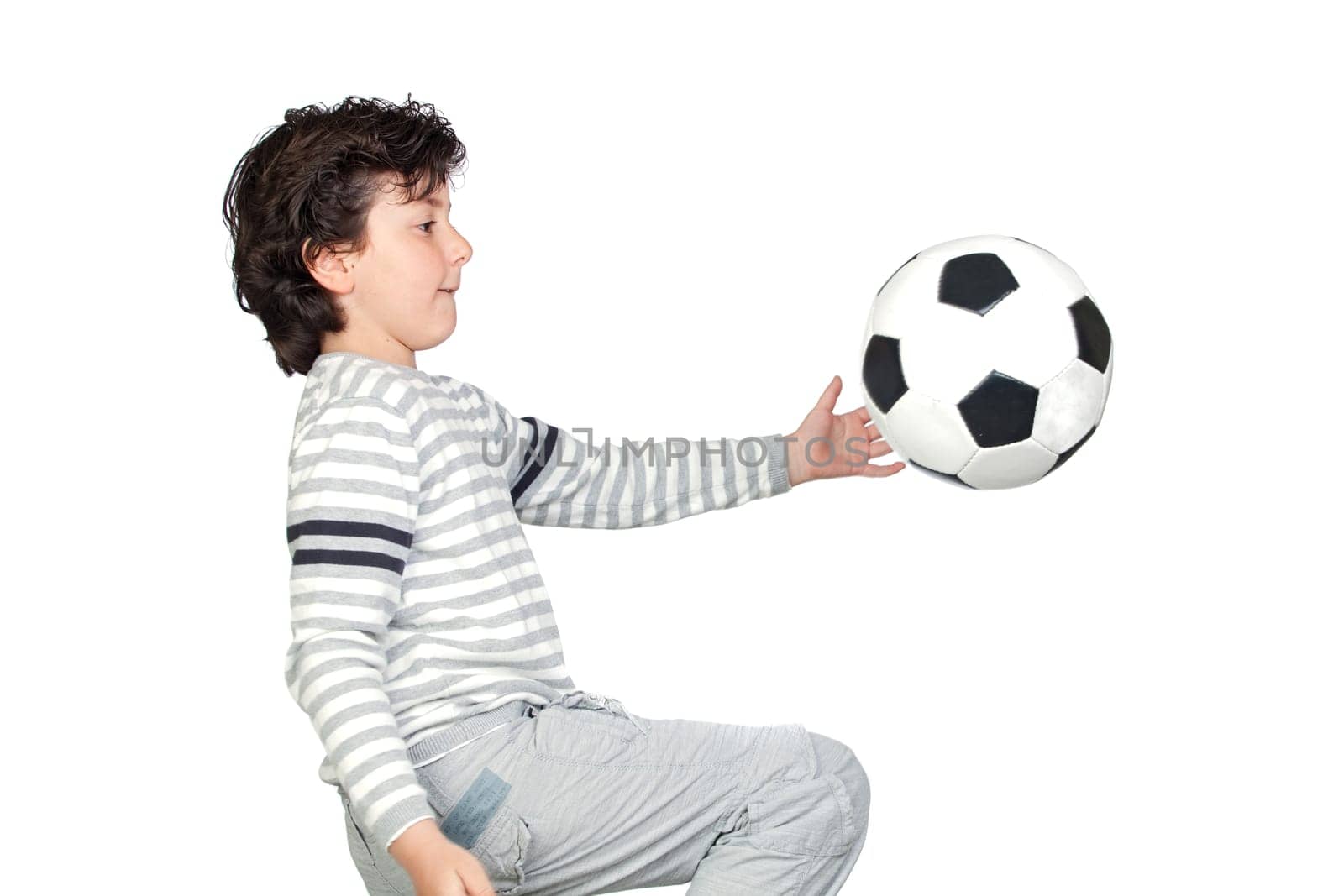 Adorable child playing with a soccer bal