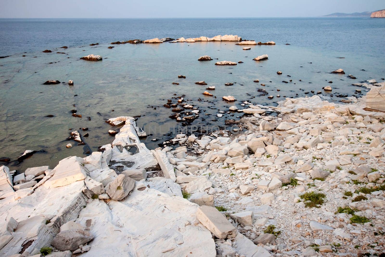 Blocks of marble in the sea on Aliki