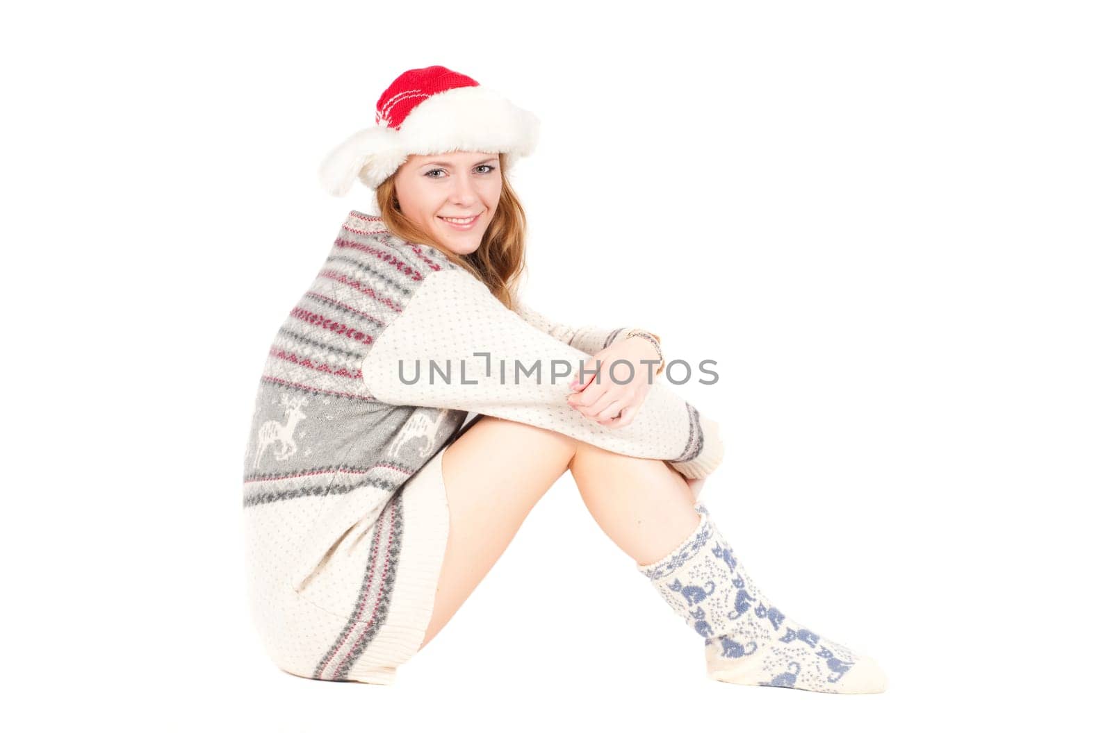 Beutiful woman in cardigan and santa hat