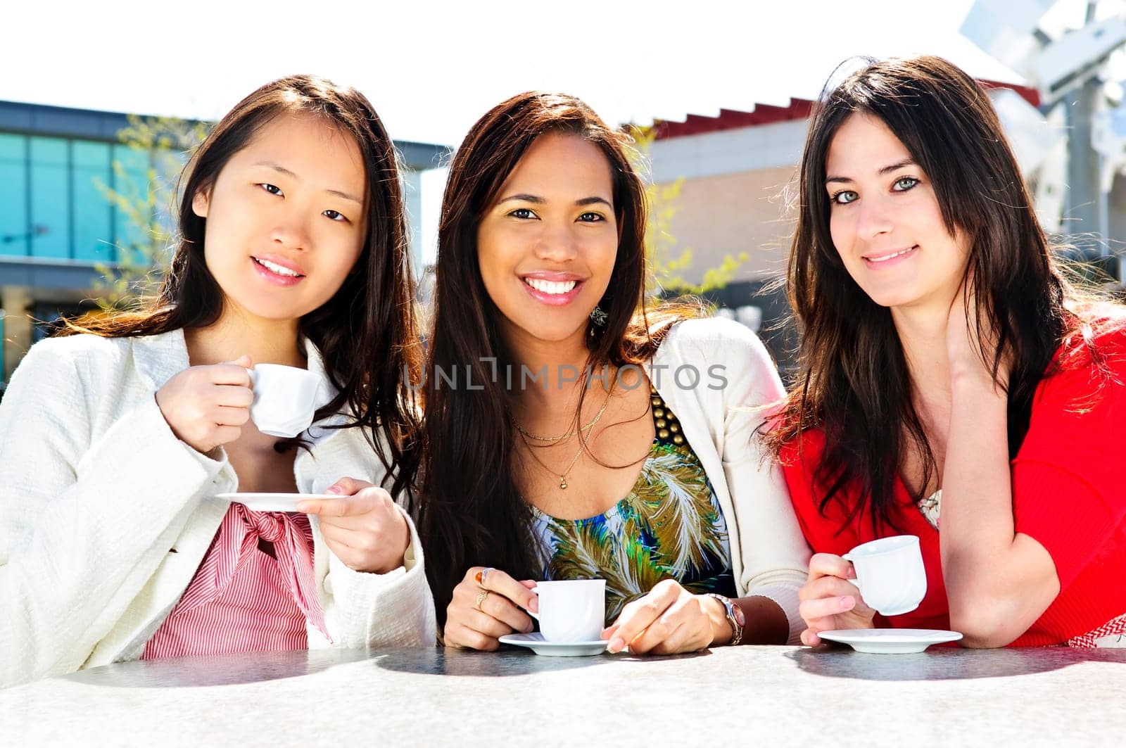 Group of girlfriends having coffee