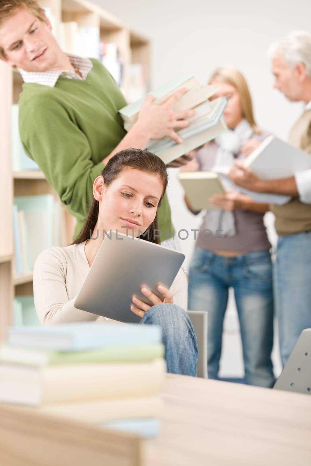 Touch screen tablet computer - students in library