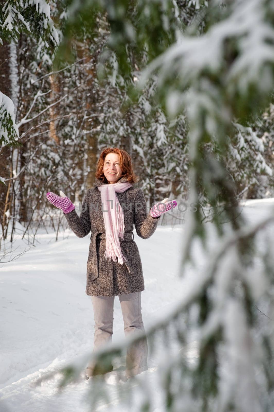 Happy red-haired woman having fun on win