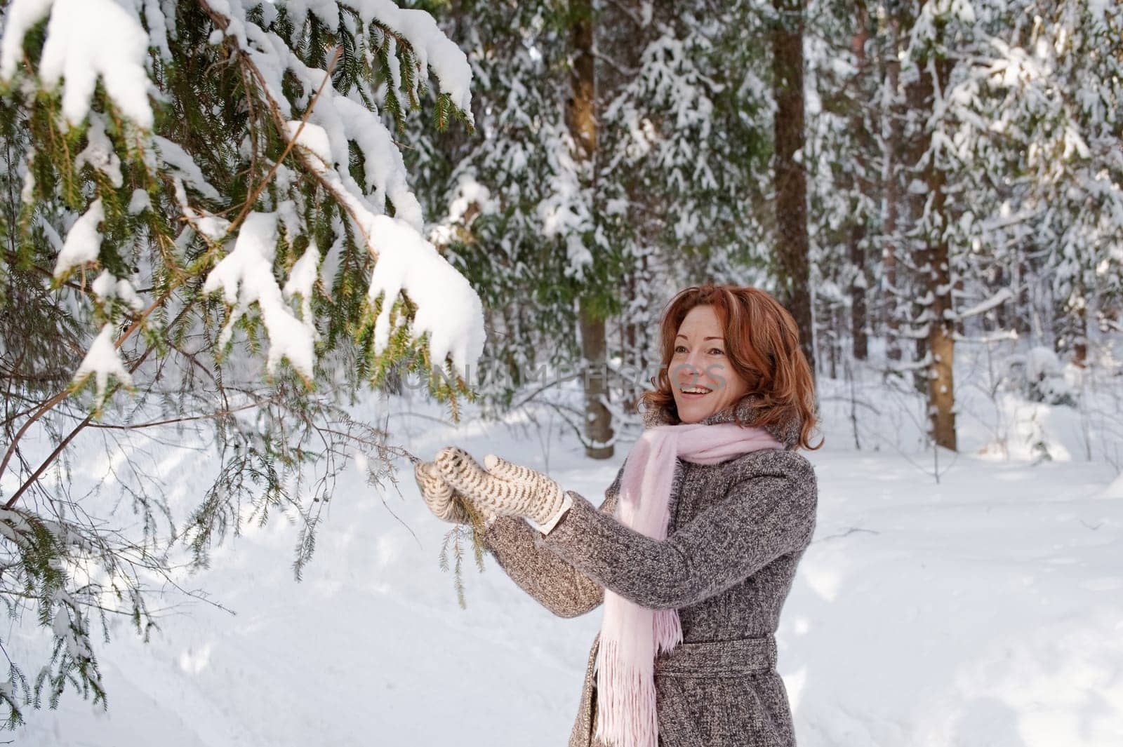 Happy red-haired woman having fun on win