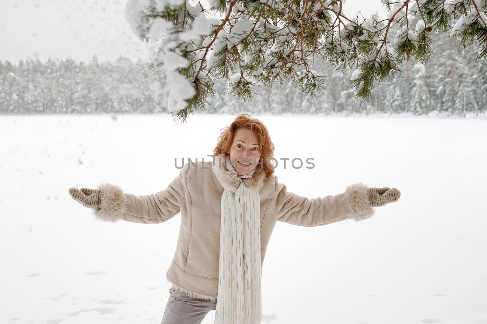 Attractive red-haired woman having fun o
