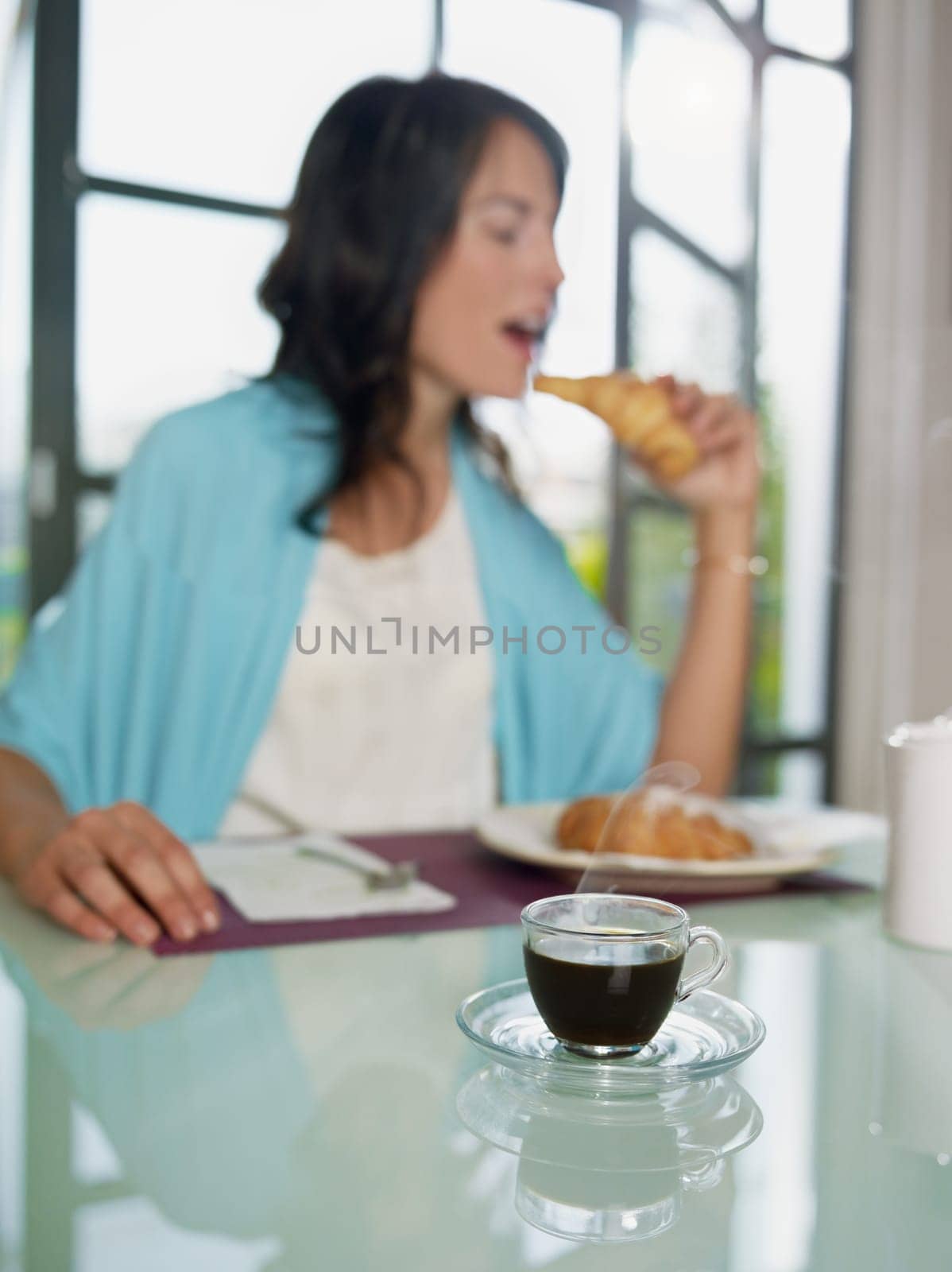 woman having breakfast at home