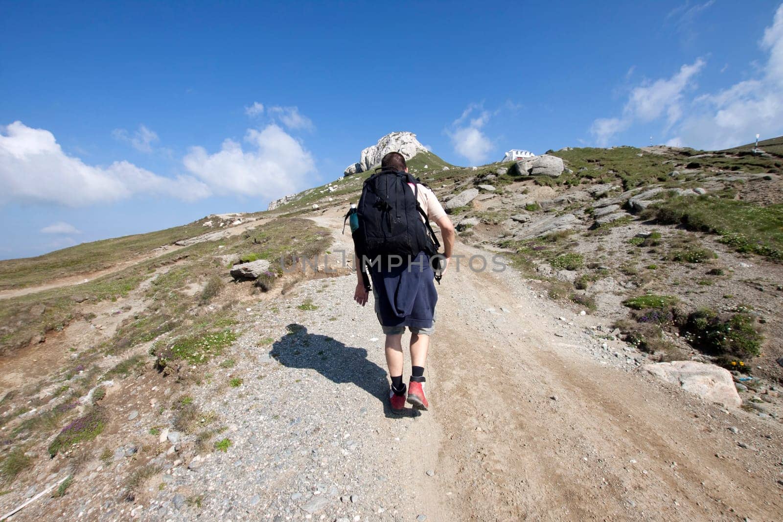 Man trekking in high mountains