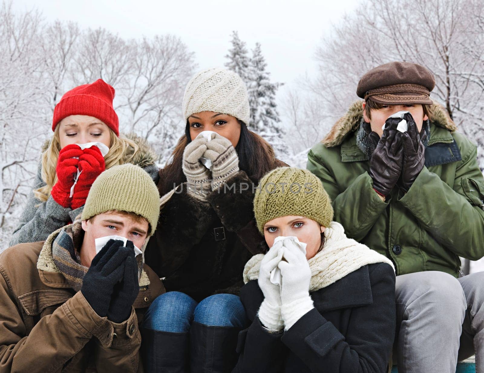 Group of friends with colds outside in winter