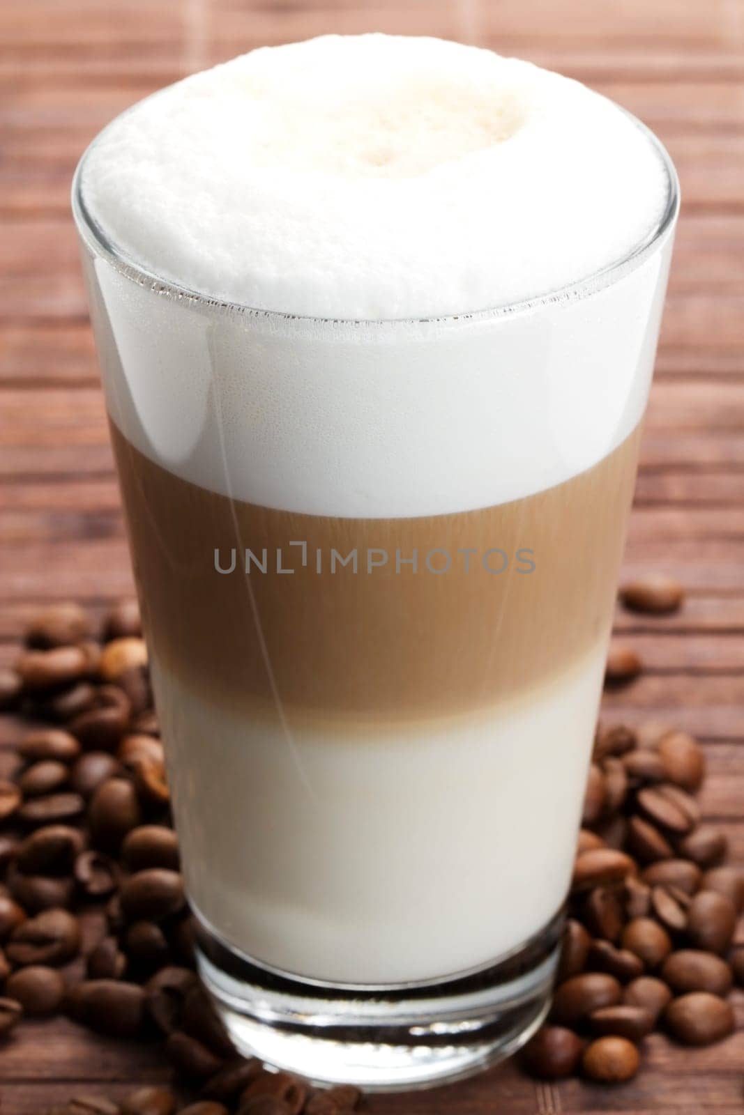 Latte macchiato with coffee beans