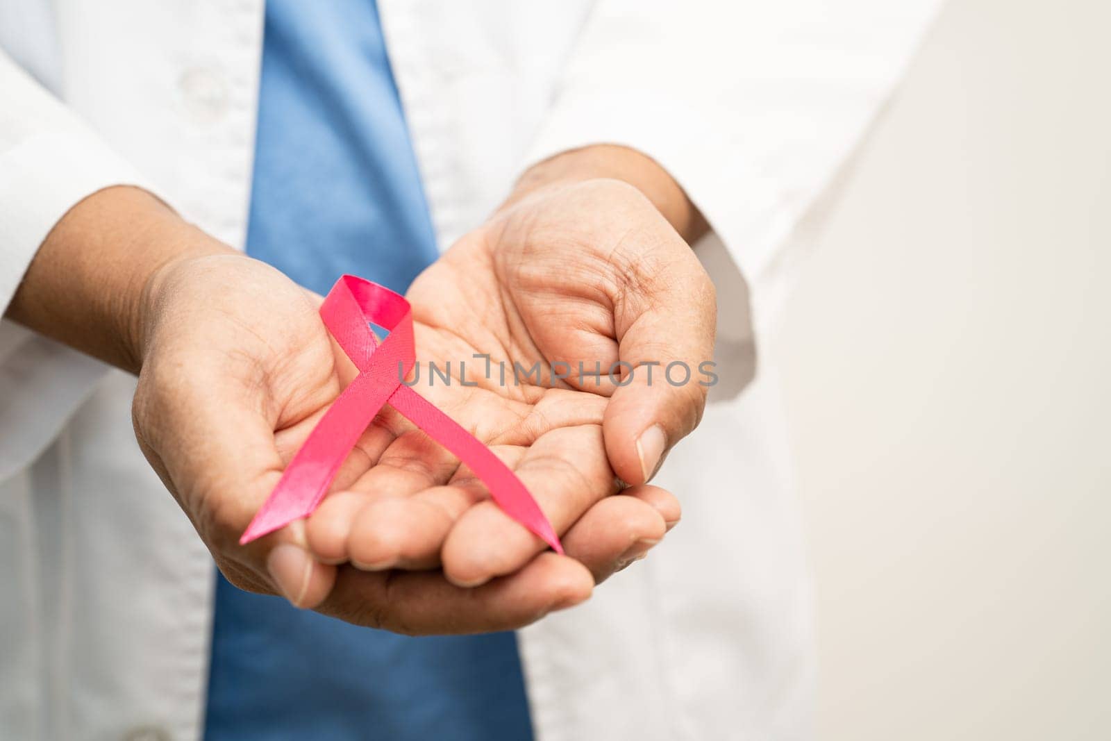 Asian woman doctor with purple ribbon, sign of Alzheimer disease day, Pancreatic cancer, Epilepsy, Lupus.