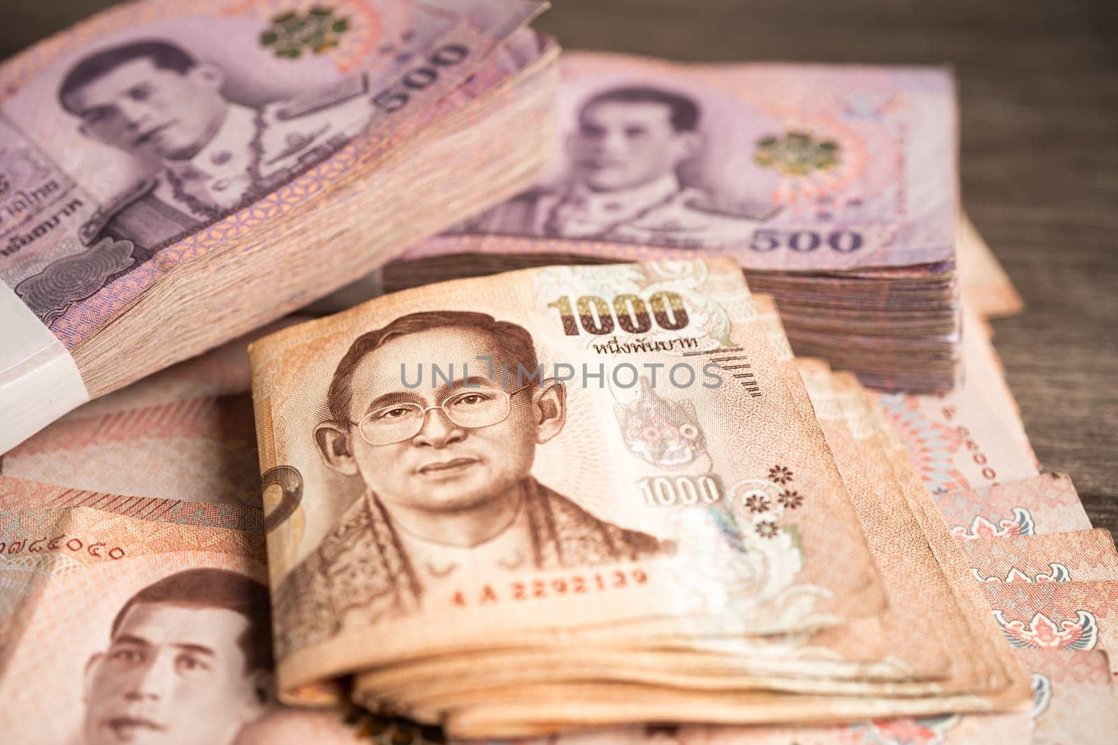 Thai baht banknotes, business saving finance investment concept. by pamai