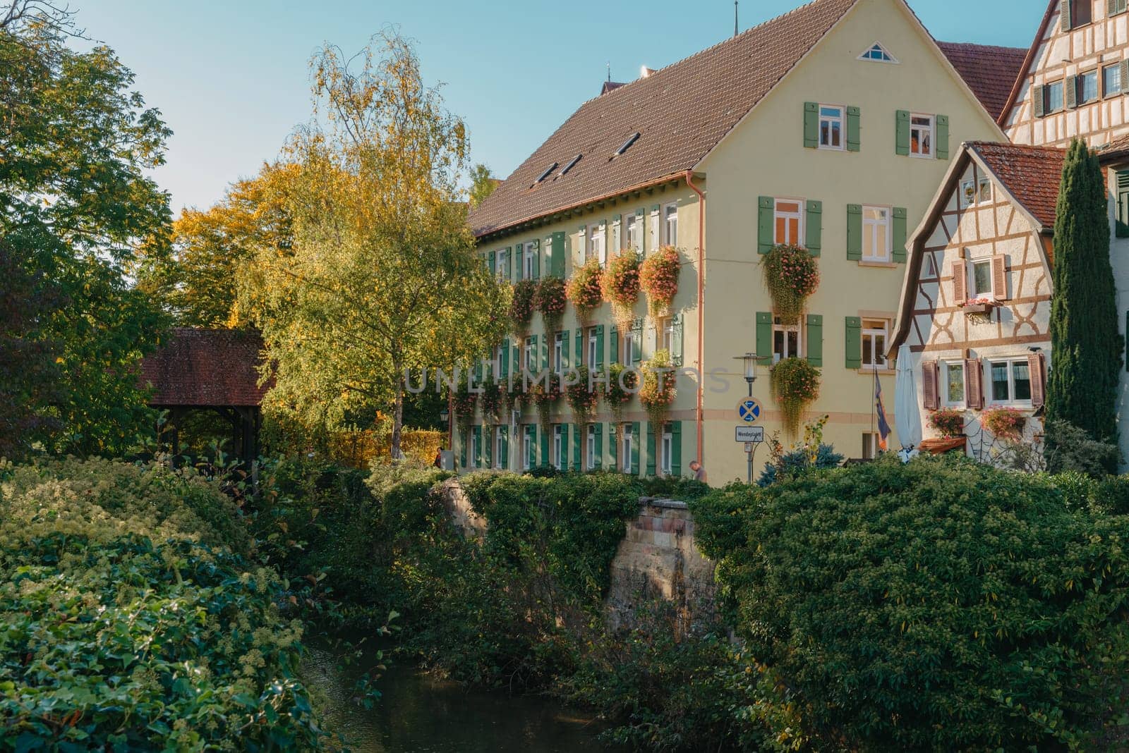 Old national German town house. Old Town is full of colorful and well preserved buildings. Baden-Wurttemberg is a state in southwest Germany bordering France and Switzerland. The Black Forest, known for its evergreen scenery and traditional villages, lies in the mountainous southwest. Stuttgart, the capital, is home to Wilhelma, a royal estate turned zoo and gardens. Porsche and Mercedes-Benz have headquarters and museums there. The 19th-century Hohenzollern Castle sits in the Swabian Alps to the south.