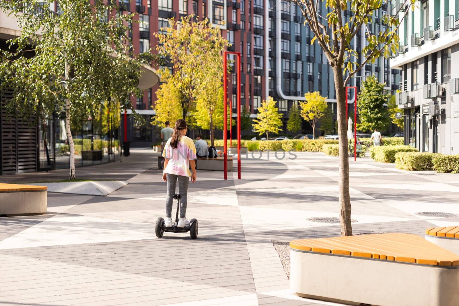 Electriic hyroscooter driving. Person self balancing hoverboard. Driving giroscooter. by Andelov13