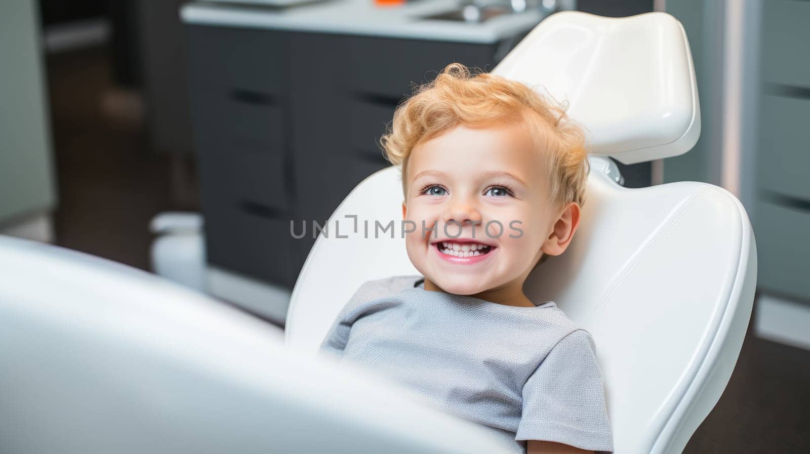 Little girl with a white smile in the dental chair. by natali_brill