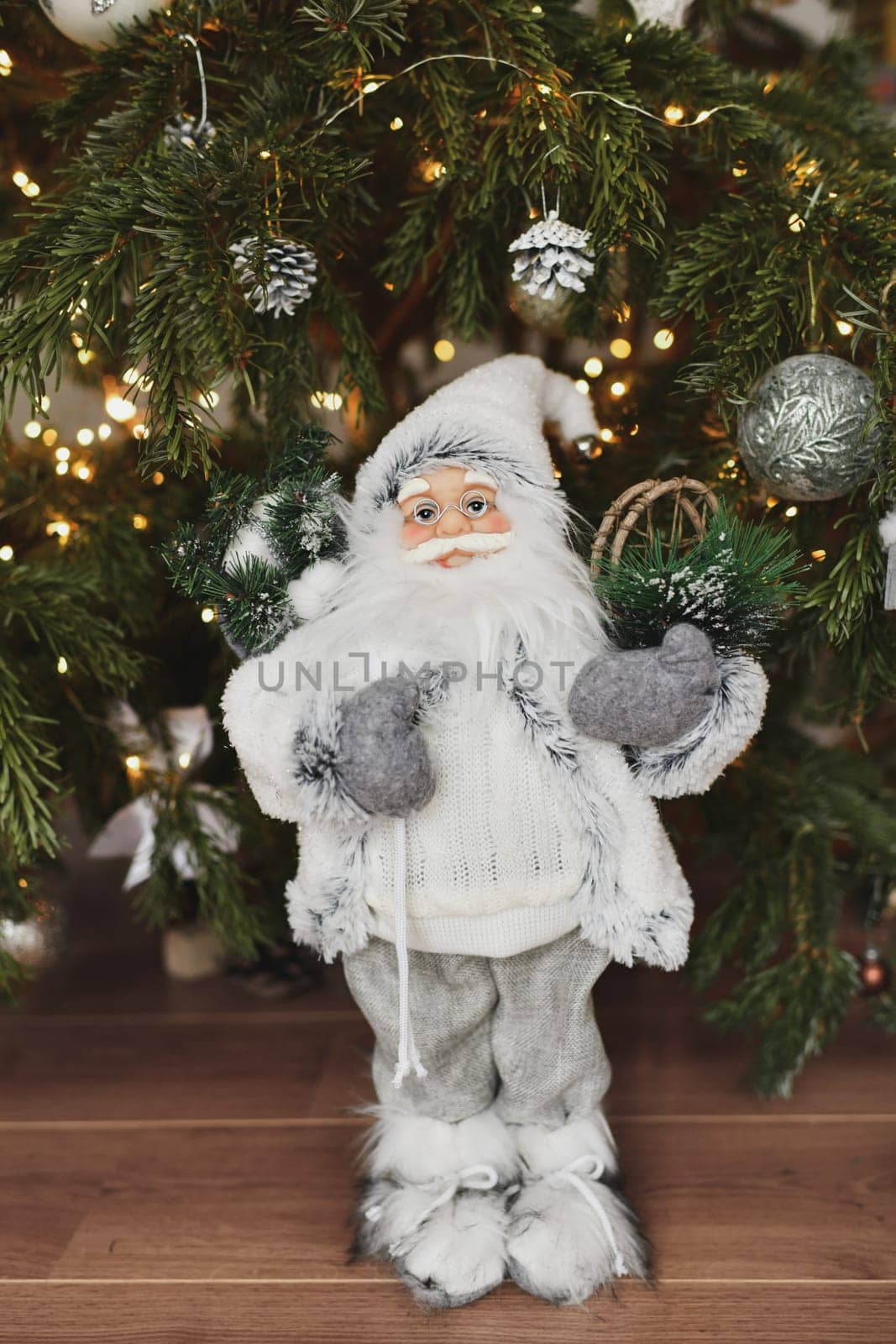 Christmas decorations Santa Claus standing under the Christmas tree